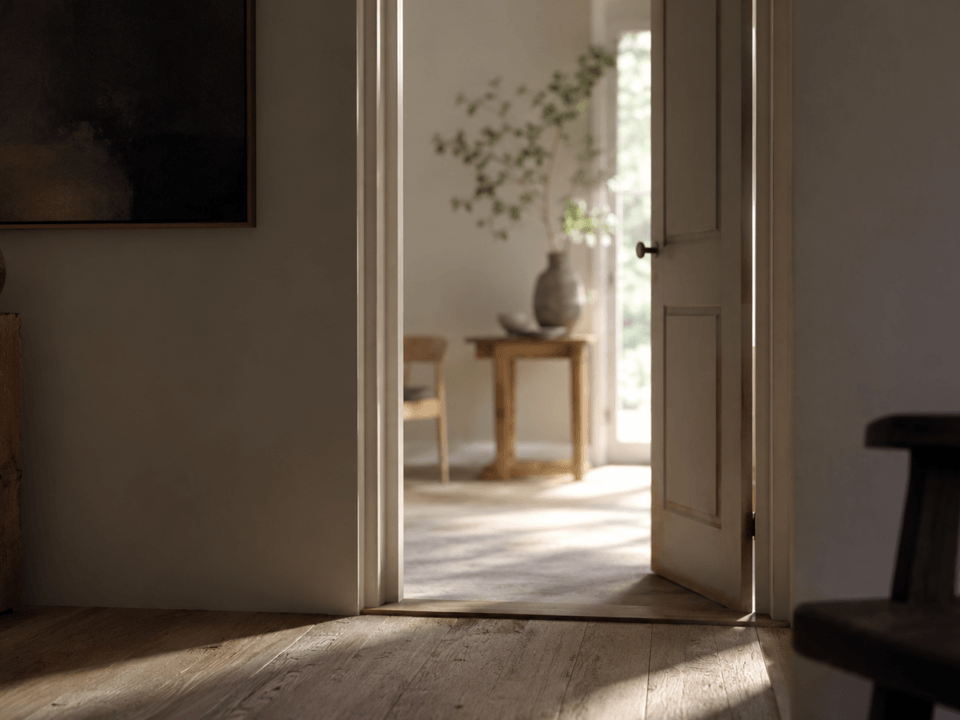 Editorial photograph of an open doorway in a calm, well-lit room, illustrating the difference between boundaries and walls in marriage.